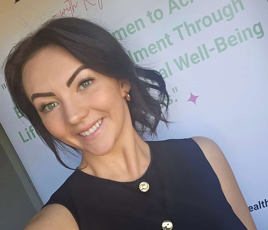 Self-confident woman smiling, representing mental health and personal growth.
